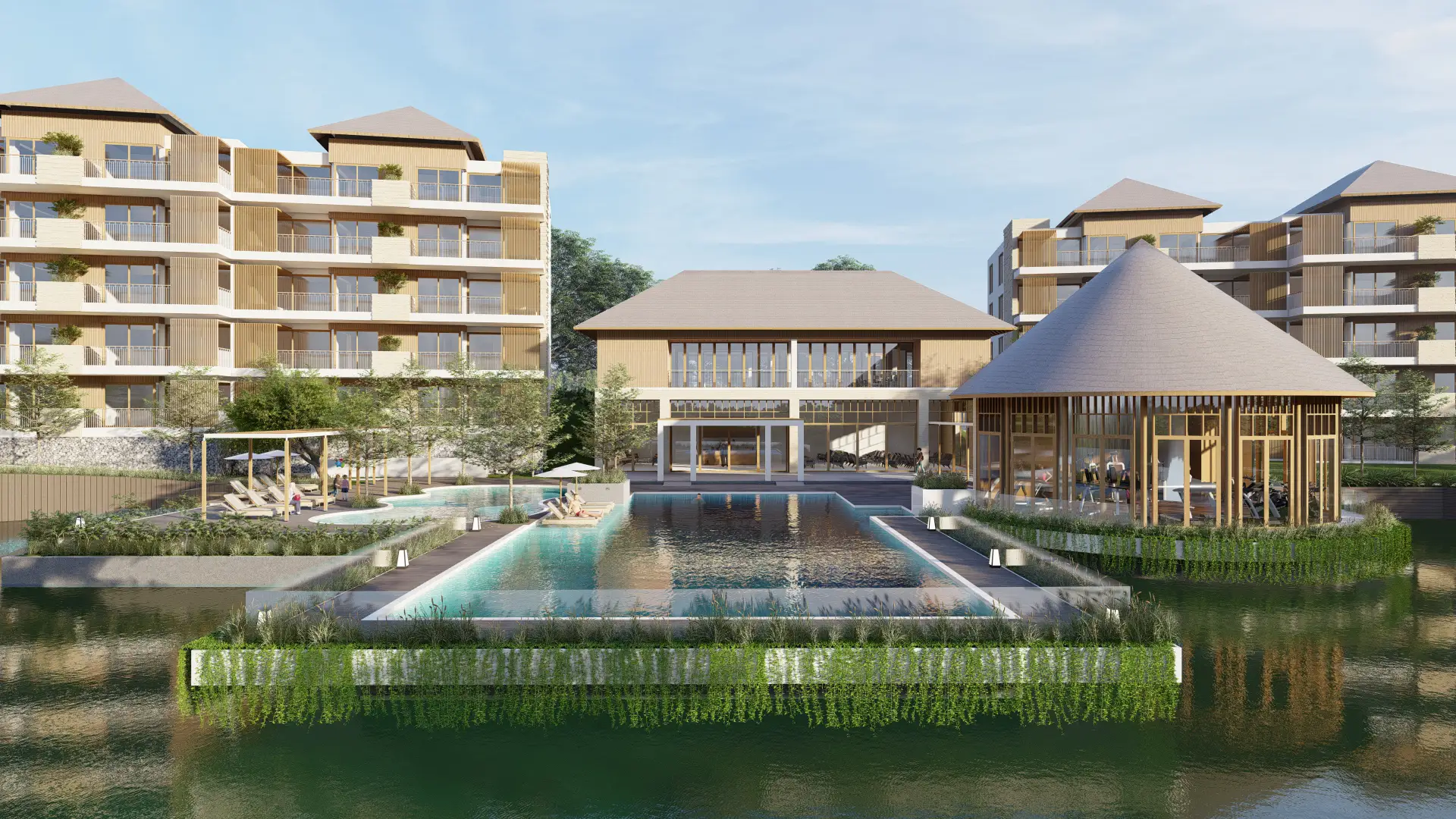 Clubhouse and pools on the lake, with the low-rise residences behind